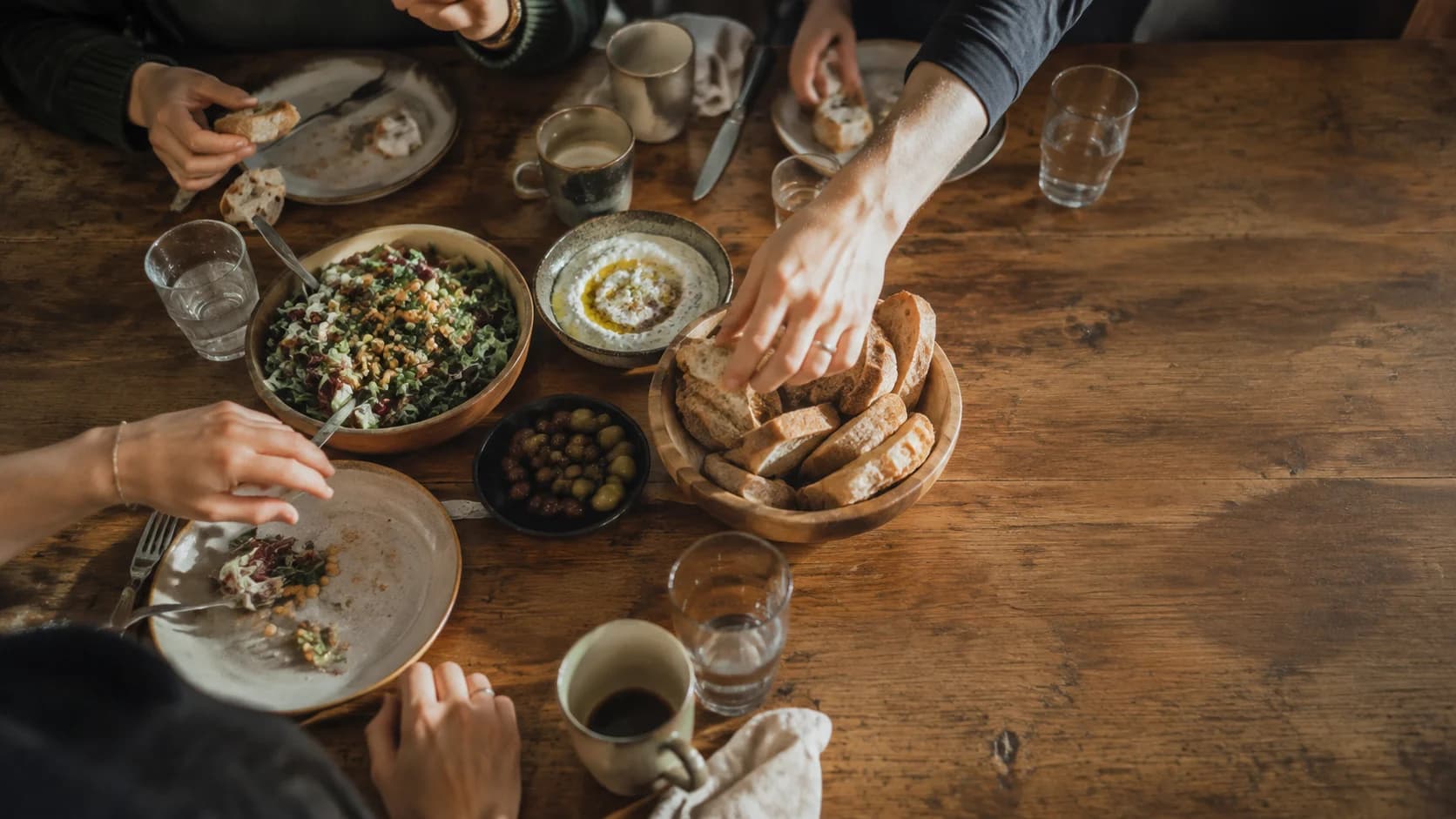 Friends sharing food around a table